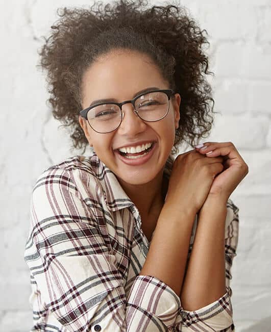 young smiling african american woman wearing glasses