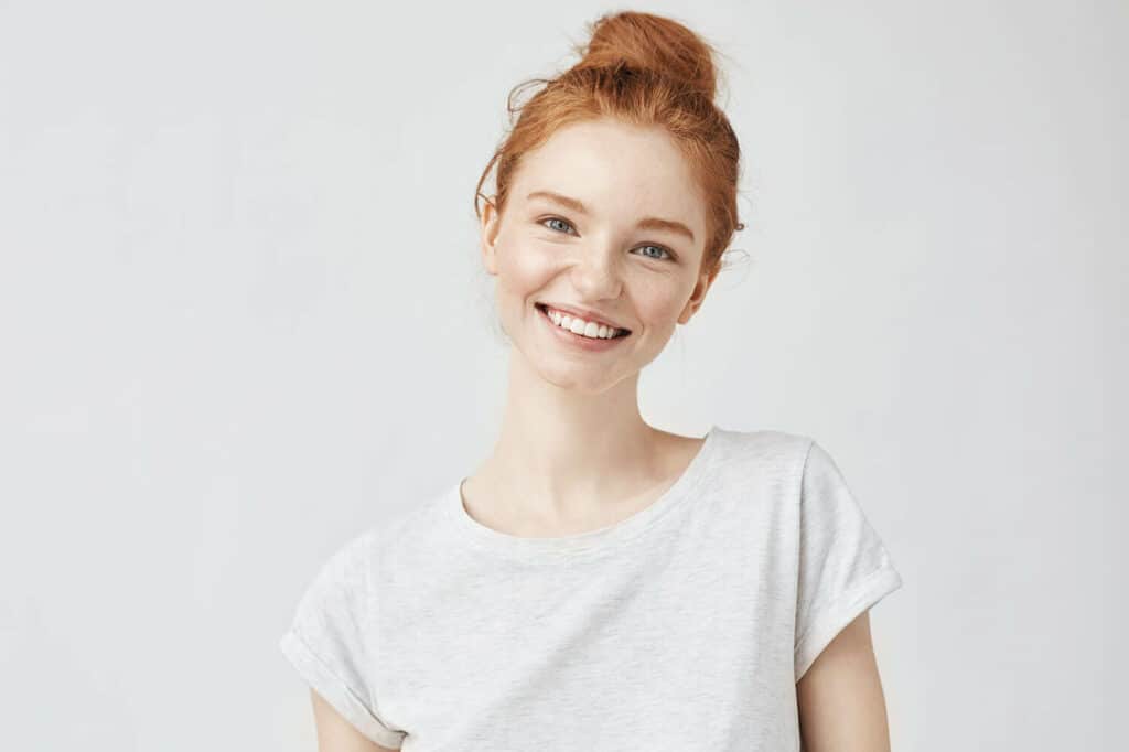 young red head woman smiling